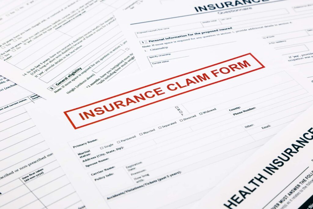 Insurance claim form with supporting medical records prepared for review by the insurance company.