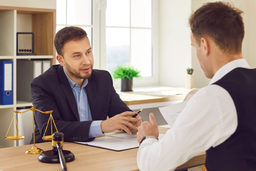 Attorney assisting a client with legal options for a hit-and-run car accident in Gainesville, GA.