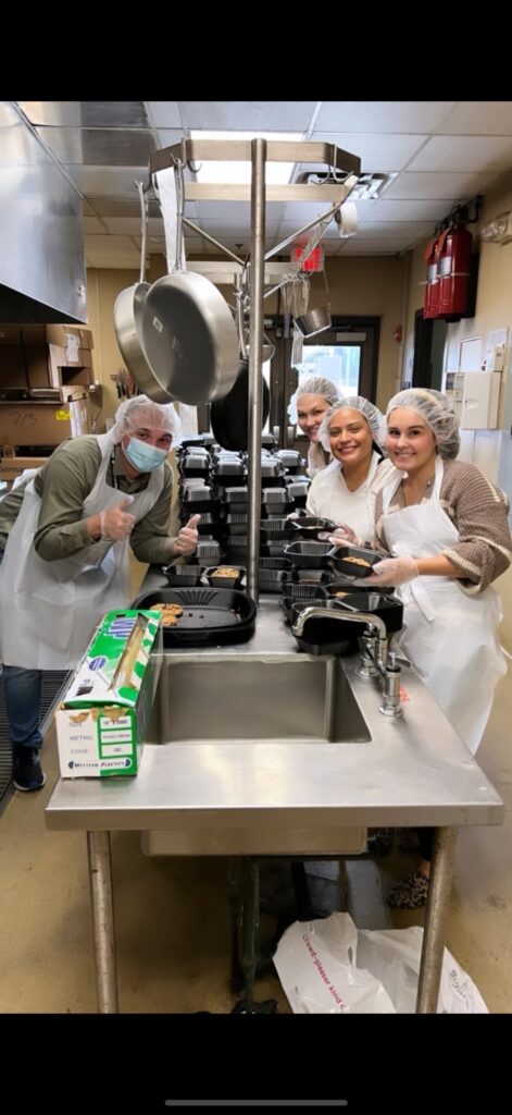 Scott Pryor Law Group employees volunteering at Atlanta Mission Organization kitchen.