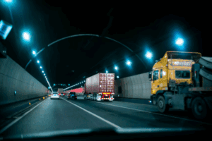 Tunnel road in Georgia where large trucks are driving through.